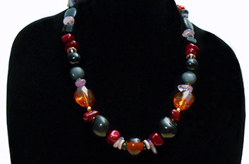 Slide show of Amber, Black, and Red Necklace by artist Susan Ray Euler.