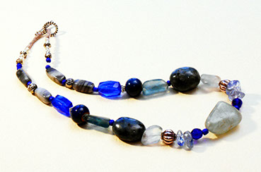 Artisan made necklace in shades of cobalt blue glass, blue-green fluorite and quartz stone by Susan Ray Euler.